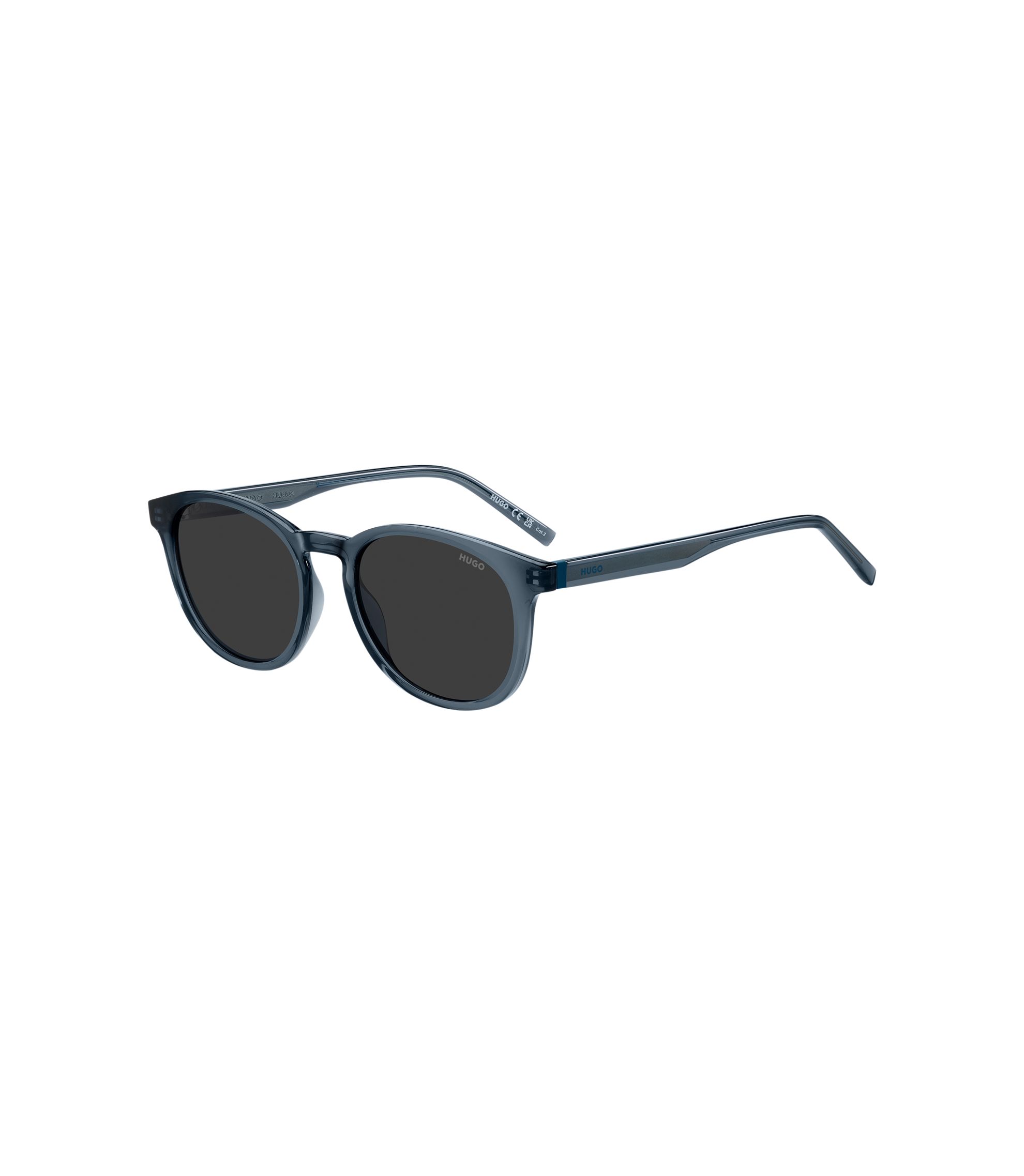 Sonnenbrille aus blauem Acetat mit Gummibesatz