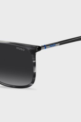 Graue Sonnenbrille aus gemustertem Acetat mit r&ouml;hrenf&ouml;rmigen Metallb&uuml;geln, Grau gemustert