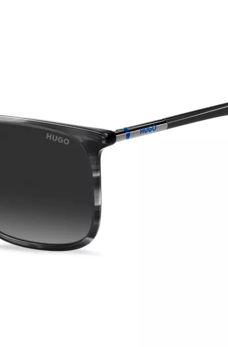 Lunettes de soleil en acétate gris à motif avec branches tubulaires en métal