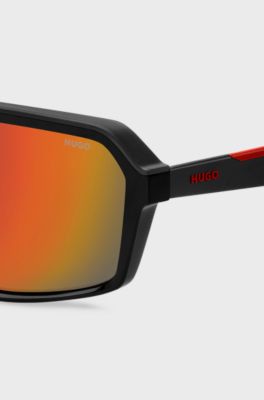 Mask-style sunglasses with red shaded lenses, Black