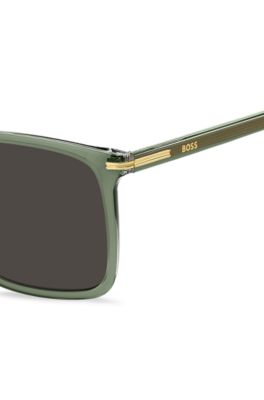 Zonnebril van groen acetaat met goudkleurige details, Groen