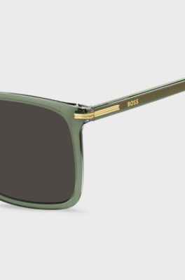 Gafas de sol de acetato verde con ribetes en tono dorado, Verde
