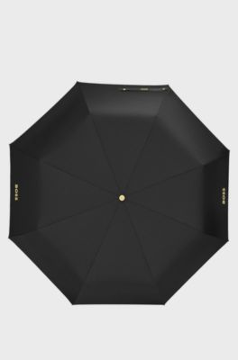 Taschenschirm mit Monogramm-Print in Schwarz und Gold, Schwarz