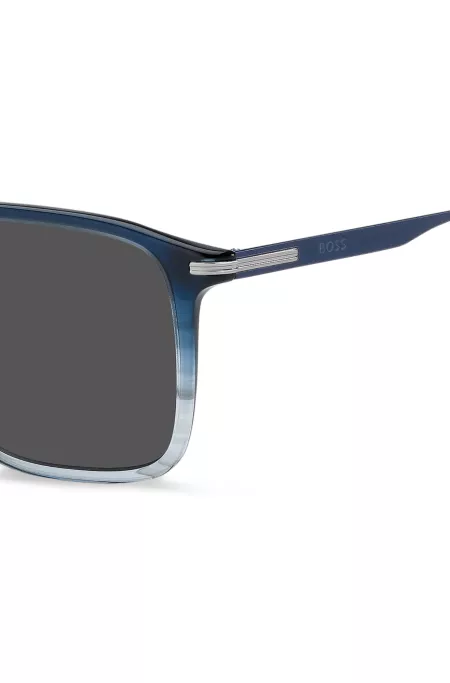 Blaue Sonnenbrille mit Degradé-Optik und Streifen-Detail