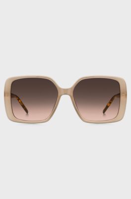 Transparente Sonnenbrille in Nude mit Double-B-Monogramm, Beige