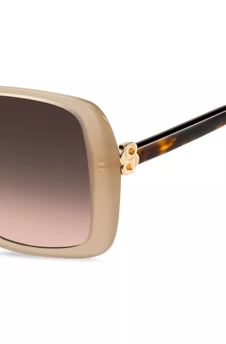 Lunettes de soleil transparentes couleur chair avec monogrammes Double B