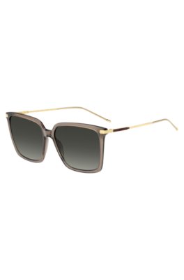 Transparent-brown sunglasses with gold-tone trims