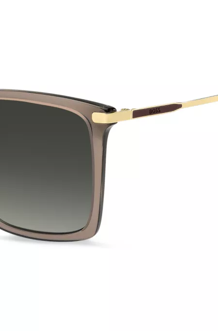 Transparent-brown sunglasses with gold-tone trims