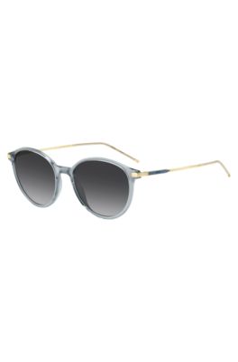 Blue-grey sunglasses with gold-tone temples, Lysebl&aring;