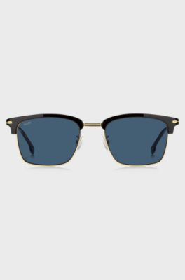  Blue-lens sunglasses with black and gold-tone frames, Black