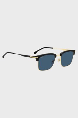  Blue-lens sunglasses with black and gold-tone frames, Black