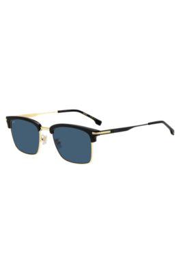  Blue-lens sunglasses with black and gold-tone frames, Black