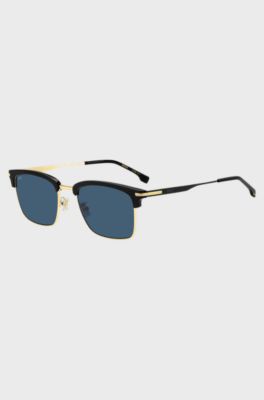  Blue-lens sunglasses with black and gold-tone frames, Black