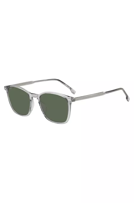 Transparent-graue Sonnenbrille mit Logo an den Bügeln