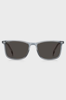 Transparent-blaue Sonnenbrille mit Logo auf den B&uuml;geln, Grau