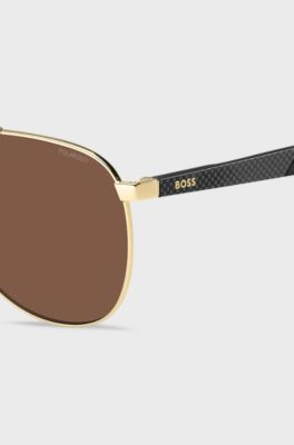 Goldfarbene Sonnenbrille mit gemusterten B&uuml;geln, Goldfarben