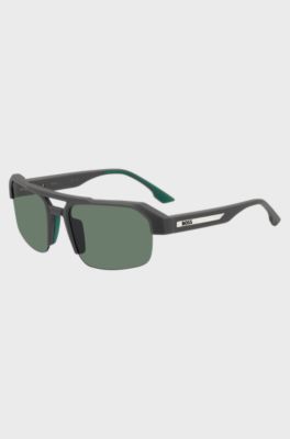 Graue Sonnenbrille mit Einsatz und Logo an den B&uuml;geln, Grau