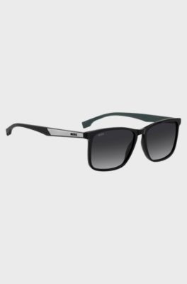 Black sunglasses with green inner temples and logo inserts, Assorted-Pre-Pack