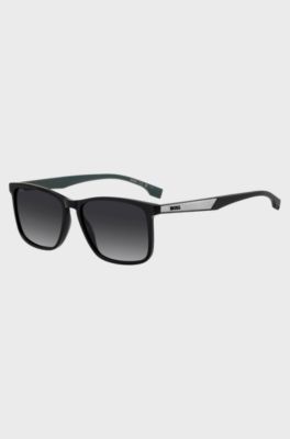 Black sunglasses with green inner temples and logo inserts, Assorted-Pre-Pack
