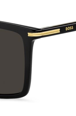 Sonnenbrille aus schwarzem Acetat mit goldfarbenen Details, Schwarz