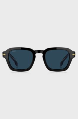 Sonnenbrille aus schwarzem Acetat mit goldfarbenen Details, Schwarz