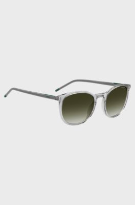 Transparent-graue Sonnenbrille mit gr&uuml;nem Logo, Hellgrau