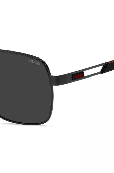 Black double-bridge sunglasses with rubber logo