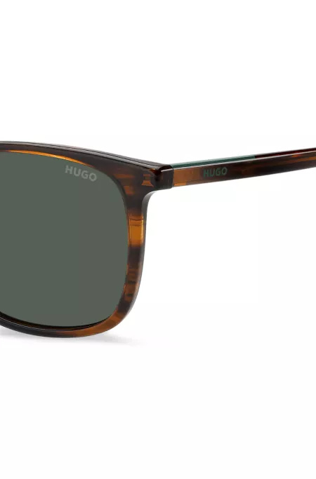 Sonnenbrille in brauner Horn-Optik mit Logo-Details