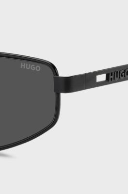 Black-metal sunglasses with cut-out logo, Black