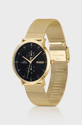 Style gold-tone watch with black dial, Gold tone