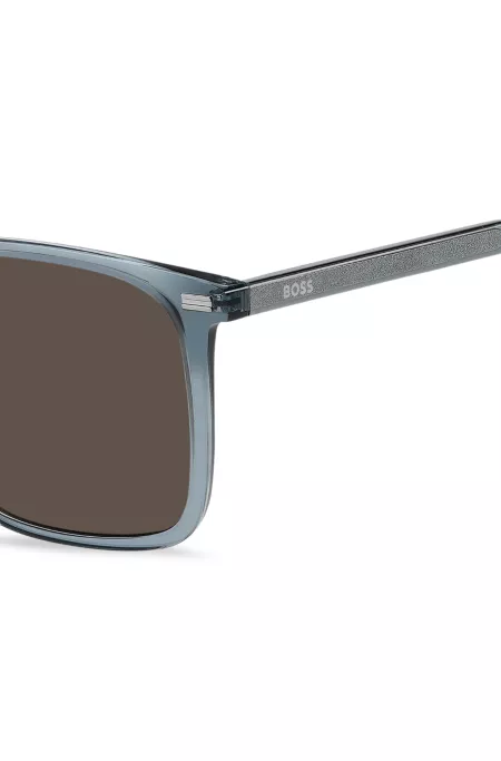 Sonnenbrille aus transparent-blauem Acetat mit silberfarbenen Details