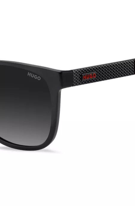 Lunettes de soleil noires et mates avec branches à motif