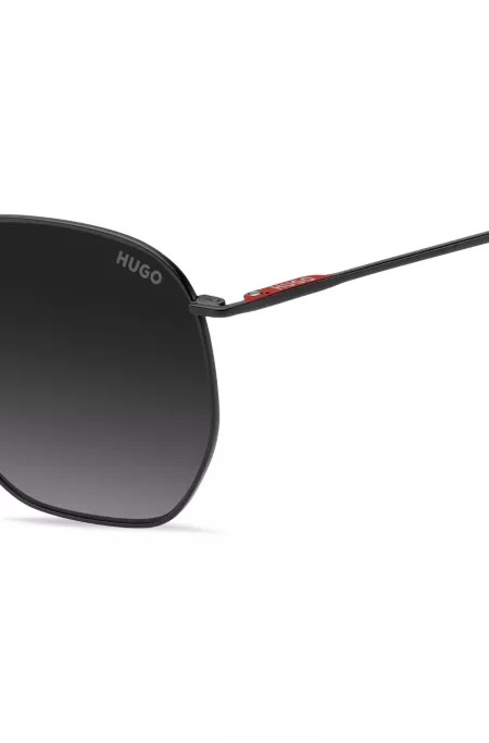 Matte-black sunglasses in stainless steel with red details