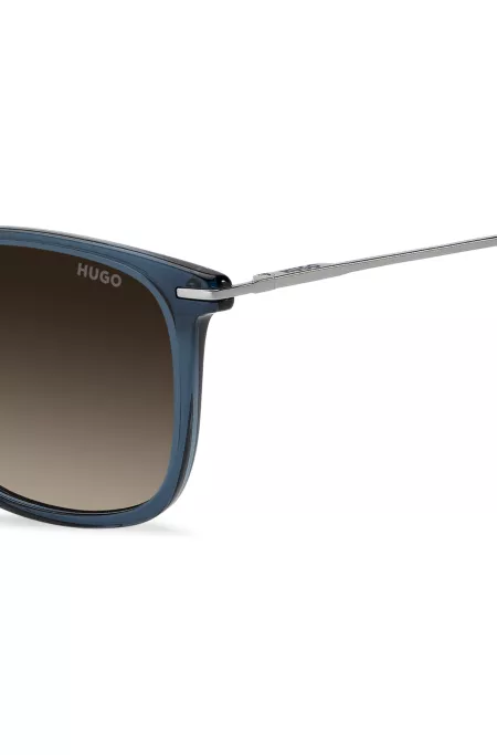 Lunettes de soleil en acétate bleu transparent avec branches en acier inoxydable