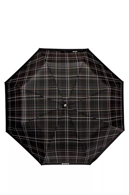 Parapluie de poche à carreaux noirs avec poignée en similicuir