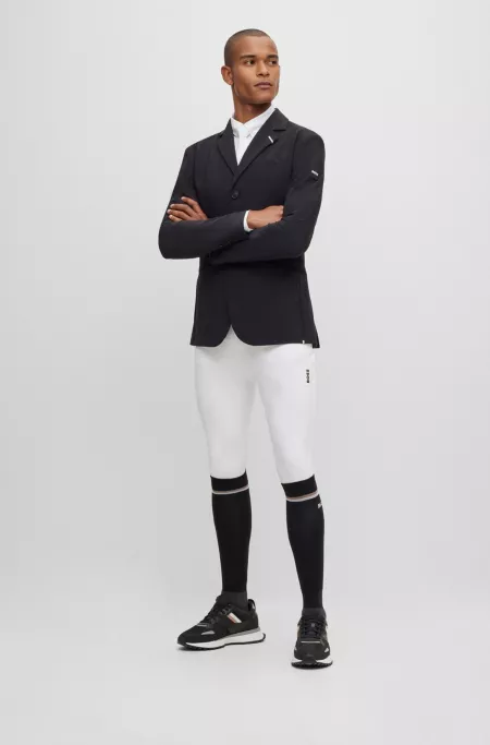 Equestrian knee-grip breeches in power-stretch material