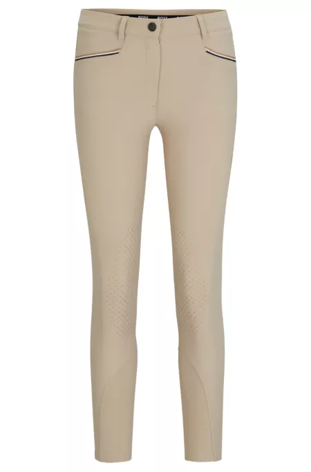 Equestrian knee-grip breeches in power-stretch material
