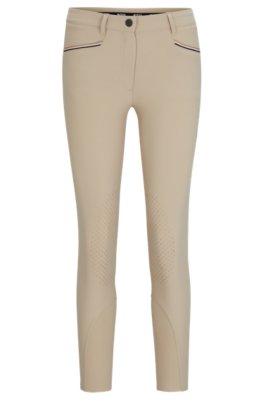 Equestrian knee-grip breeches in power-stretch material