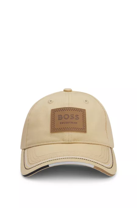 Equestrian cap with retro-inspired logo patch