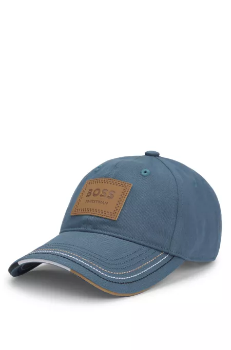 Equestrian cap with retro-inspired logo patch
