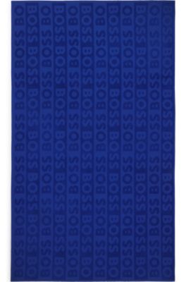 コットン ビーチタオル スカルプテッドロゴ, ブルー