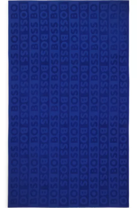 Cotton beach towel with sculpted logo