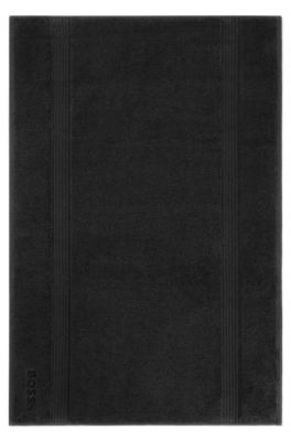 Svart badmatta i bomull med broderad logga, Svart