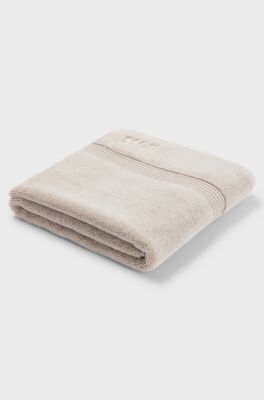 Beige badmat van Ege&iuml;sche katoen met ton-sur-ton logo, Lichtbeige