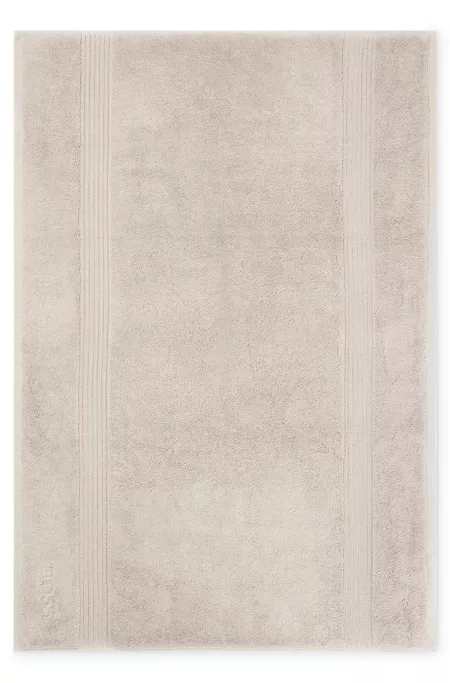 Beige Aegean-cotton bath mat with tonal logo