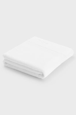 White cotton bath mat with embroidered logo, White