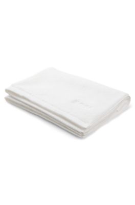 Cotton bath mat with contrast embroidered logo, White