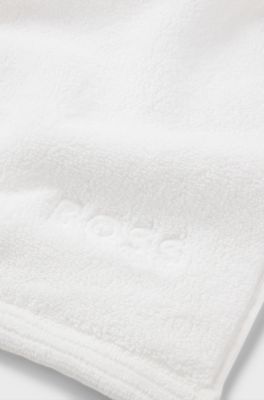 Cotton bath mat with contrast embroidered logo, White