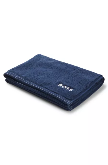 Cotton bath mat with contrast embroidered logo