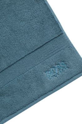 Cotton bath mat with embroidered logo, Blue